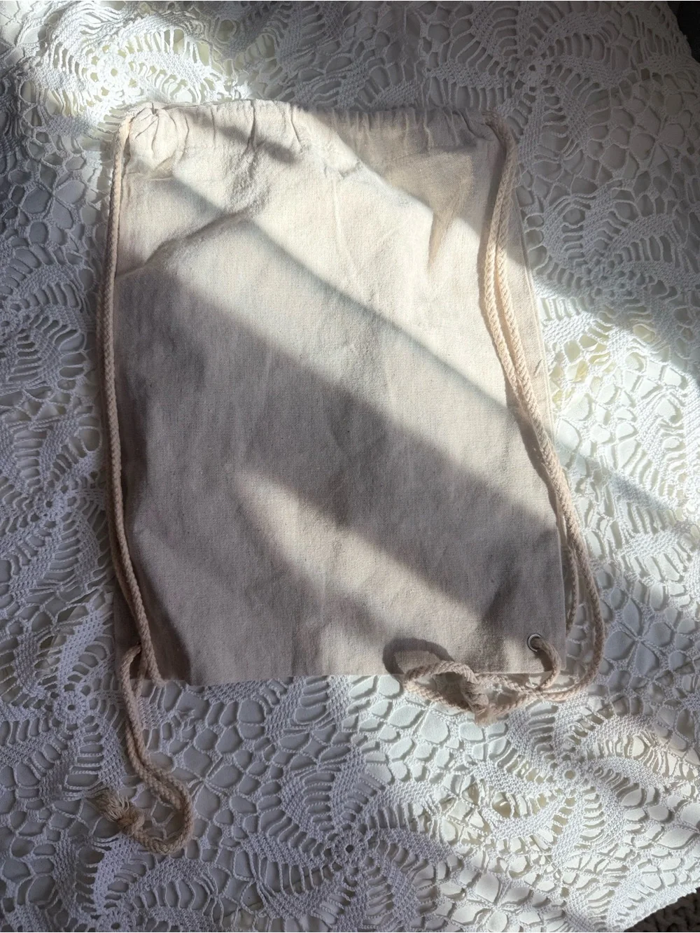 Coldplays “Everyone Is An Alien Somewhere' Beige Drawstring Bag